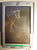 Palm PDAs and dumb people dont match The Front of a mangled Palm T3